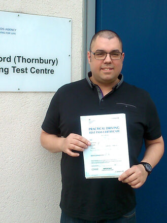 Daniel from BD10 celebrating his second attempt driving test pass at Thornbury test centre in Bradford with SUX-S Driving School.