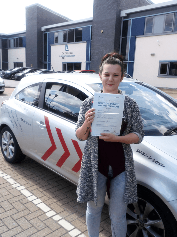 Kristina from LS28 holding her driving test pass certificate after passing on her first attempt at the Thornbury test centre with SUX-S Driving School.