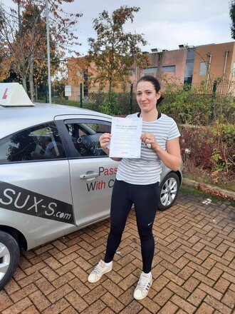 Emma from BD10 smiling after passing her driving test on her second attempt at Thornbury test centre in Bradford with SUX-S Driving School.